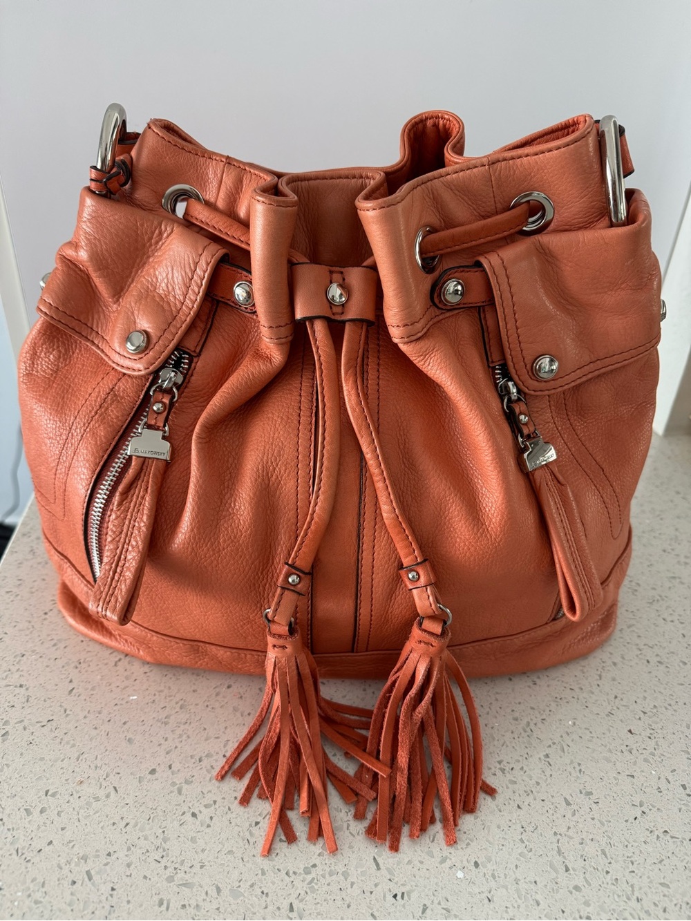 b. makowsky Coral Peach Leather Drawstring Hobo with Tassels